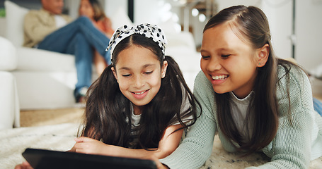 Image showing Sisters, girls and tablet for streaming movies, series and playing games or online, social media on floor. Laughing, people and fun or smile, humor and comedy on technology, meme and website or silly