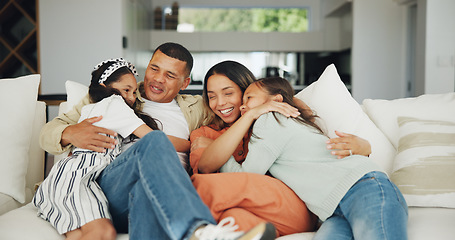 Image showing Love, hug and happy family on a sofa with support, care and security in their home together. Smile, embrace and girl children with parents in a living room for bond, playing and having fun in a house