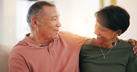 Image showing Retirement, couple and hug with love in morning, home or conversation with support in living room. Mature, people and talking together with embrace on sofa in lounge of apartment or vacation in house