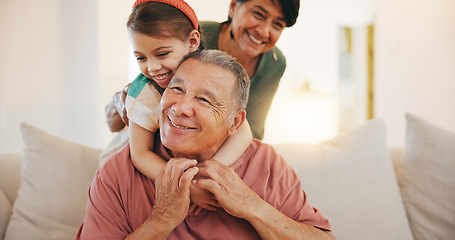 Image showing Grandparents, child and play with smile, home and embrace with love, grandchild and couch. Man, woman and lounge or bonding together for relationship, family and retired with girl, house and kid