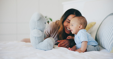 Image showing Happy, mom and baby with teddy bear in bedroom or home with love, care and support in morning. Newborn, child and mother smile together and bonding with toys, fun or kid laughing on bed in house