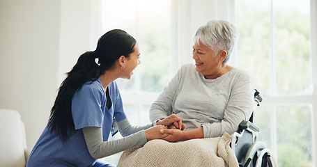 Image showing Happy woman, doctor and holding hands with senior patient in wheelchair, support or trust for healthcare at home. Medical nurse, caregiver or person with a disability smile for care or help at house