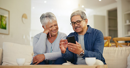 Image showing Senior couple, smartphone and social media with smile, conversation and living room sofa. Grandparents, technology and communication with family, man and woman in retirement, happy and connection