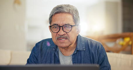 Image showing Laptop, home and senior man online for internet banking, life insurance and mortgage payment. Reading screen, retirement and elderly person on computer for networking, communication and website