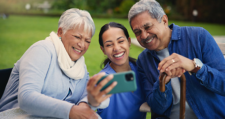 Image showing Happy woman, doctor and senior people in selfie for photography, elderly care or retirement in nature. Medical nurse or caregiver smile with mature couple for picture, photograph or memory at park