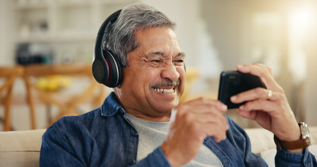 Image showing Senior, man and headphone with phone in home for streaming, online and mobile app. Elderly person, smile and excitement for technology with connection, cellular or network for entertainment on web