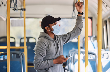 Image showing Man in bus with mask, phone and commute to city in morning, checking service schedule or social media. Public transport safety in covid, urban travel and person in standing with smartphone connection