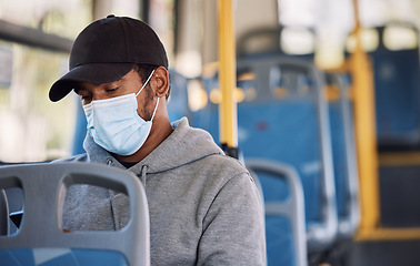 Image showing Man in bus with mask, checking phone and morning travel to city, reading service schedule or social media. Public transport safety in covid, urban commute and person in sitting with smartphone app.