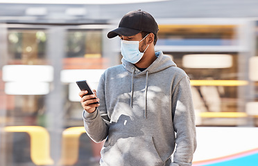 Image showing Man, mask or cellphone in city, walk and cold protection or text notification on travel in town. Young person, urban or medical cover on mouth for flu virus, transport safety for healthcare crisis