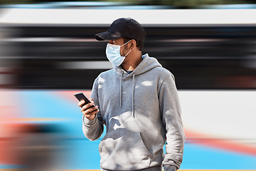 Image showing Man in city with mask, phone and bus stop for morning travel, checking service schedule or location. Public transport safety in covid, urban commute and person in street with smartphone on mobile app