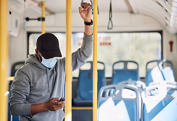Image showing Man in bus with mask, phone and reading on morning travel to city, checking service schedule or social media. Public transport safety in covid, urban commute and person in standing with smartphone.