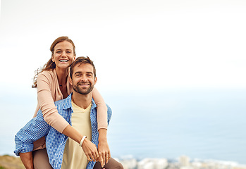 Image showing Couple, piggy back and smile in portrait, outdoors and vacation or holiday, date and bonding for love. Happy people, play and fun on trip, travel and connection in marriage, support and trust or face