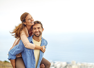 Image showing Couple, piggy back and smile for love, outdoors and vacation or holiday, date and bonding in nature. Happy people, play and fun on trip, travel and connection in marriage, support and trust or face