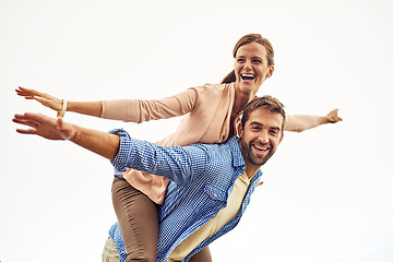 Image showing Couple, piggy back and smile for travel, outdoors and vacation or holiday, date and bonding for love. Happy people, play and freedom on trip, airplane and connection in marriage, support and trust