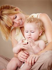 Image showing Hug, love and mother with baby for playing, games or bonding in their home together. Family, face and parent embrace boy child in a living room having fun with building blocks, toys or learning