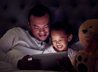 Image showing Man, child and digital tablet streaming movies, cartoon or game in bed at night. Happy father and son browsing the internet, online or web with social media app while watching a comedy in the bedroom