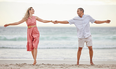 Image showing Love, beach and couple happy, smile and romance, care and marriage relationship together. Summer, holiday and happiness with man and woman by the sea on travel vacation trip for freedom or honeymoon