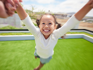Image showing Girl child happy, parent pov of fun outdoor in garden and parent hand swinging kid by arms in circle movement. Family play game on green grass landscape park, young happiness and kids funny smile