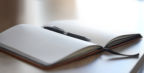 Image showing Office mockup notebook and pen on a desk for work, writing or planning a schedule. Professional, empty and Isolated texture book, diary or notepad with blank paper to write information on wood table