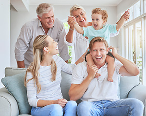 Image showing Children, family and baby with grandparents, a child and his parents during a visit while sitting on a sofa in a living room. Kids, happy and smile with a senior man and woman at home with relatives