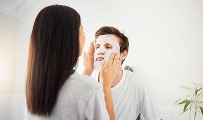 Image showing Couple facial in bathroom, beauty mask cleanser on man face and skincare wellness product. Cosmetic cleaning, young marriage together and beautiful woman showing self love and relax in home together