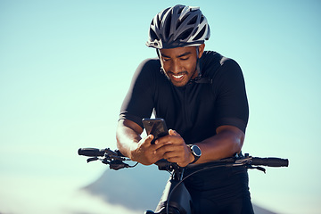 Image showing Bicycle, phone and fitness or gps app with smile happy about progress during exercise and cycling training outdoors in summer with safety helmet. Athlete riding bike to workout and practice for race