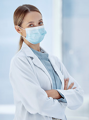 Image showing Covid, face mask or woman doctor in hospital compliance for healthcare, medicine innovation or medical motivation to stop virus. Portrait, trust or insurance support worker in global disease research