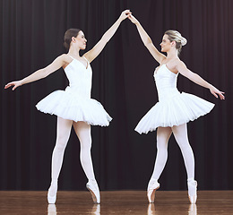 Image showing Ballet women, stage and dance performance for creative show, recital or competition in classical ballet theater. Beauty, dancer partnership and prima ballerina team work together on abstract dancing