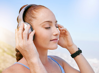 Image showing Woman, music and zen podcast during meditation in nature, relax and calm with blue sky views. Radio, wellness and yoga by girl enjoying a break with calming audio on a fitness workout alone in summer