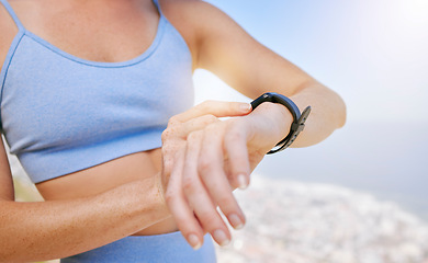 Image showing Fitness, woman and hands for time on watch checking or monitoring health after exercise training workout in nature. Hand of female in sportswear monitor check and timing in healthy outdoor sports