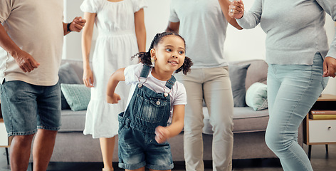 Image showing Happy girl with family dancing in living room while playing, having fun and enjoy bonding quality time together. Happy family love, connection and freedom for youth child or kid at home dance party