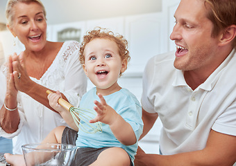 Image showing Mother, father and baby baking as a happy family in a kitchen enjoys quality time and the weekend together. Development, learning and mom cheering for her young child with dad and ready to bake cake