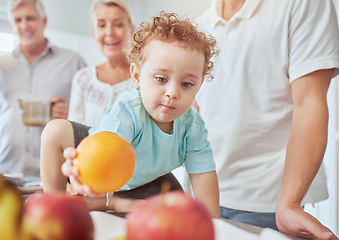 Image showing Health, family and baby with orange nutrition for healthy diet, vitamins and minerals on kitchen table at home. Food, fruit and apples for cute child growth and wellness with grandparents and parent.