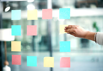 Image showing Business woman planning company growth and strategy by arranging sticky notes and managing her schedule. Closeup of an employee brainstorming ideas for a startup mission or vision