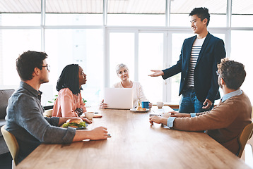 Image showing Planning, strategy and meeting with a business man talking to his team of colleagues and coworkers in the boardroom. Feeling motivated while discussing the vision, mission and growth of their company