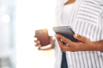 Image showing Closeup of professional business woman on her phone working and replying to messages, emails or social media with flare. Black female businessperson holding work and personal cellphone in her office