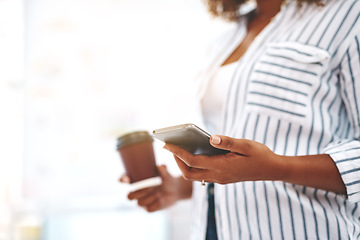 Image showing Creative checking social media on phone, texting or planning schedule while holding takeaway coffee. Closeup hands of marketing agent or woman managing startup website design and vision on technology