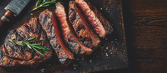 Image showing Grilled top sirloin or cup rump beef meat steak on wooden board