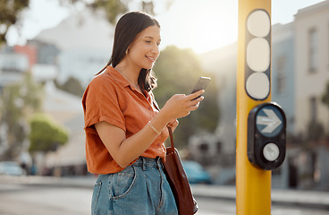 Image showing Texting on a phone, browsing social media and waiting for public transport and commuting in the city. Young female tourist enjoying travel and Looking online for places to see and visit on holiday