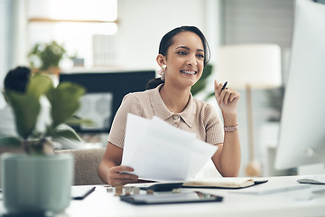 Image showing Finance manager, businesswoman or financial analyst budgets on a computer with paperwork. Young smiling accountant, insurance advisor or investment planner working on tax, bills or accounting papers