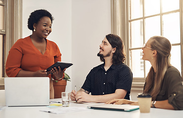 Image showing Diverse business people meeting to discuss ideas, vision and strategy for project in a marketing agency. Happy team leader and smiling manager presenting startup plan on a digital tablet in an office