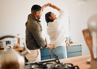 Image showing Dancing, romance and playful couple having fun, love and bonding while laughing, spinning and twirling together at home. Loving husband enjoying care, affection and joy while relaxing with happy wife