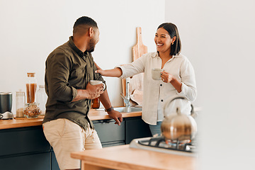 Image showing Playful, coffee and loving couple bonding and having fun together in the kitchen at home. Smiling, in love and carefree couple laughing and sharing a romantic moment while enjoying the weekend.