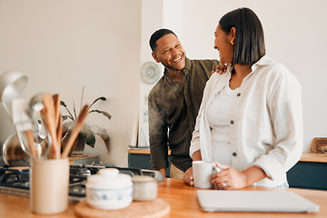 Image showing Smiling, laughing and loving, a couple in the kitchen with coffee. Happy, loving and relaxing, romantic new homeowners their house. Romance, marriage and fun, man and woman in love at the family home