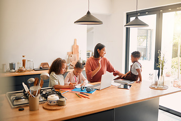 Image showing Caring parent tutoring and teaching her small children with after school activity. Loving mother taking care of young kids and helping with class homework projects in the kitchen of their family home