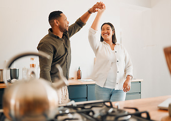 Image showing Dance, love and happy couple having fun, romance and bonding while laughing, spinning and twirling together at home. Loving husband enjoying care, smile and dancing while relaxing with playful wife