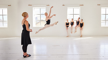 Image showing Ballet teacher, dance students and studio with group diversity of ballerina dancers in creative theatre jump performance. Theater room, art or training women in beauty or elegant learning stage class