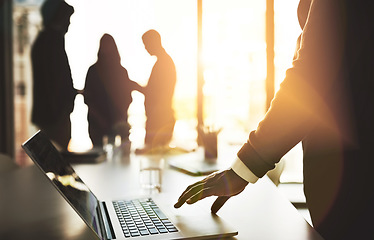 Image showing Manager with laptop, team leader and boss getting ready to lead group meeting, planning and innovation with tech. Silhouette of colleagues waiting for discussion to start or begin in office boardroom