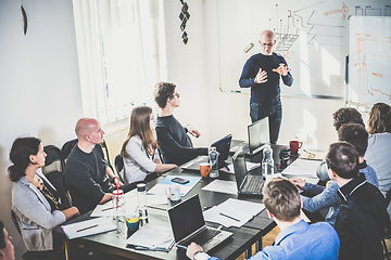 Image showing Relaxed informal IT business startup company team meeting.