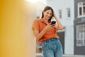 Image showing Woman texting, browsing and scrolling on phone while chatting on social media, waiting for taxi and commuting in an urban city. Happy, trendy and smiling female tourist reading online notification